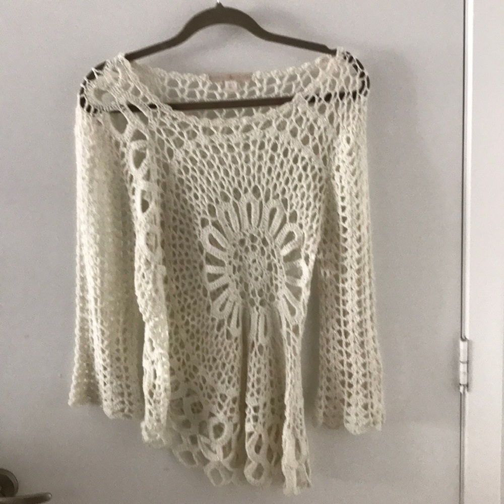 Crocheted off white a symmetrical top